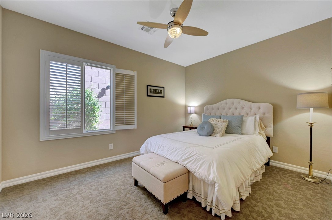 2700 Rue Montpellier Avenue Henderson, NV 89044 - Photo 29 of 39 Bedroom featuring light colored carpet and ceiling fan