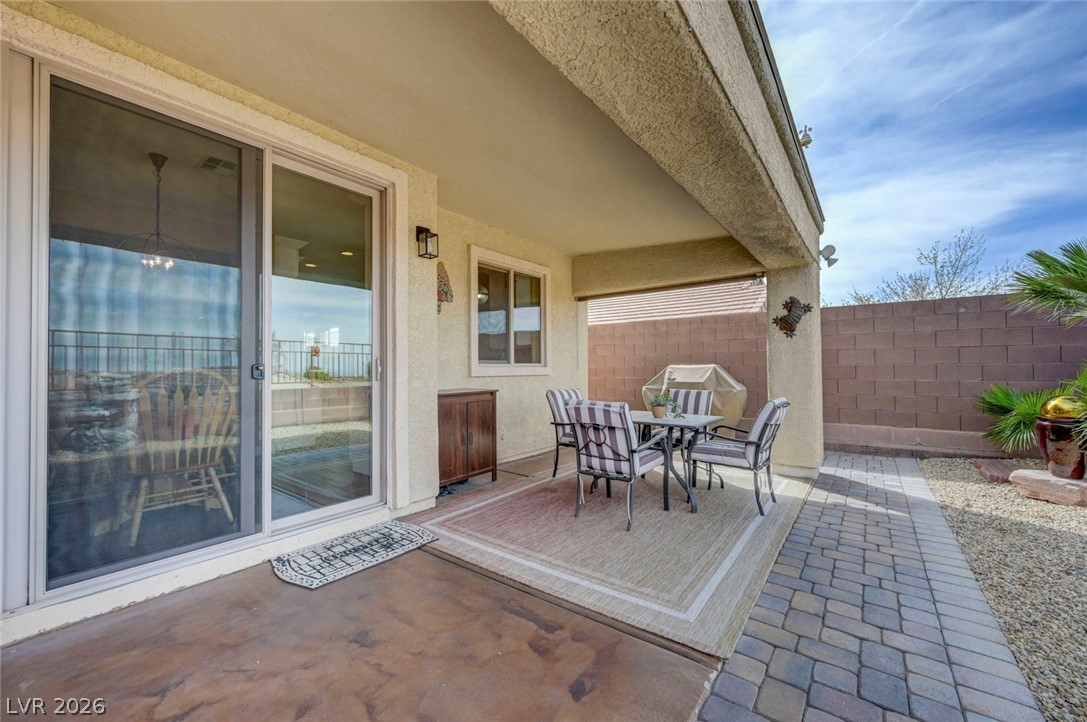 2700 Rue Montpellier Avenue Henderson, NV 89044 - Photo 34 of 39 Fenced backyard with outdoor dining space and a patio area