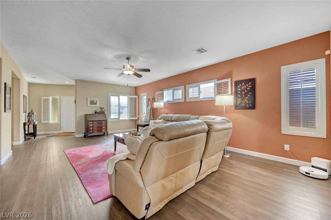 2700 Rue Montpellier Avenue Henderson, NV 89044 - Photo 6 of 39 Living room featuring light wood-style flooring and a ceiling fan