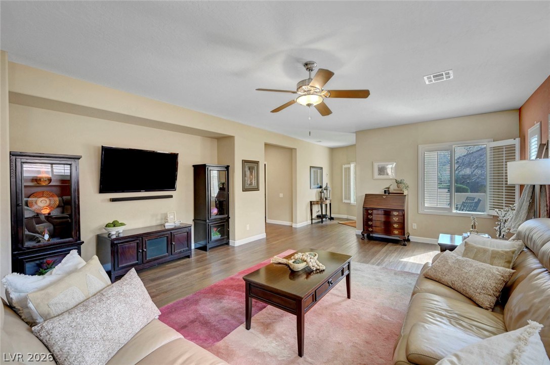 2700 Rue Montpellier Avenue Henderson, NV 89044 - Photo 7 of 39 Living room with wood finished floors and a ceiling fan