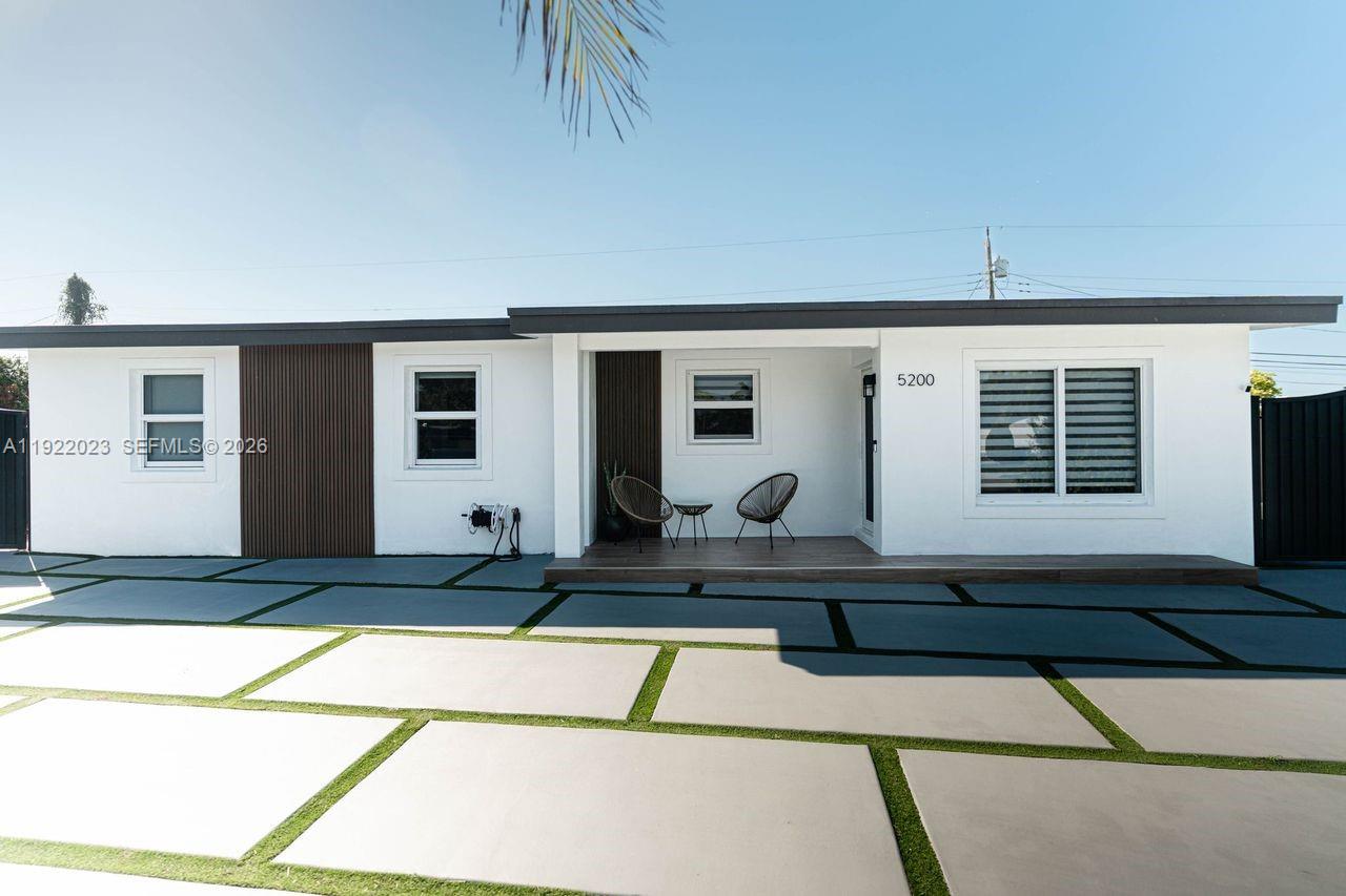 5200 Southwest 114th Court Miami, FL 33165 - Photo 4 of 36 a view of a house with backyard and sitting area