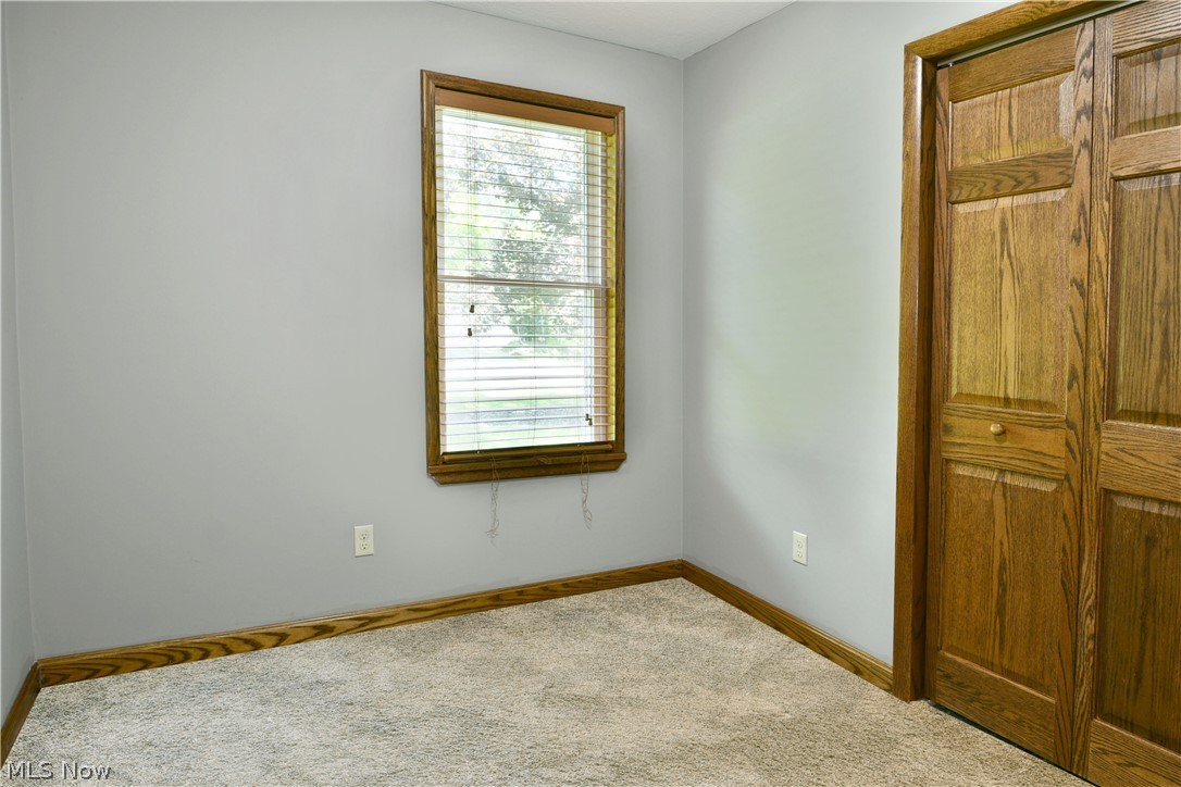 754 Warner Road Hubbard, OH 44425 - Photo 33 of 46 Light gray walls featuring a single window with wood-finish trim
