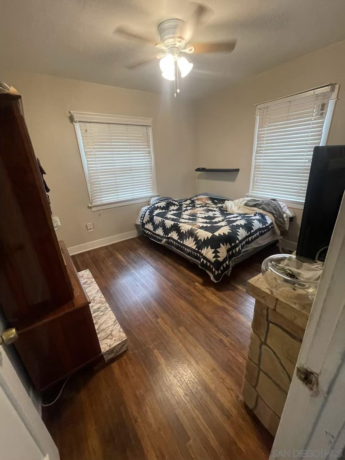 4667 35th Street San Diego, CA 92116 - Photo 11 of 29 a bed sitting in a room next to a window