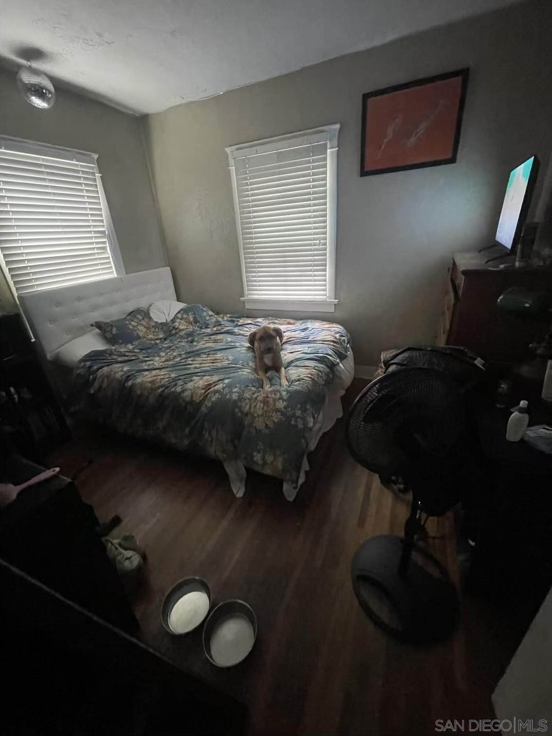 4667 35th Street San Diego, CA 92116 - Photo 13 of 29 a bedroom with a bed and window