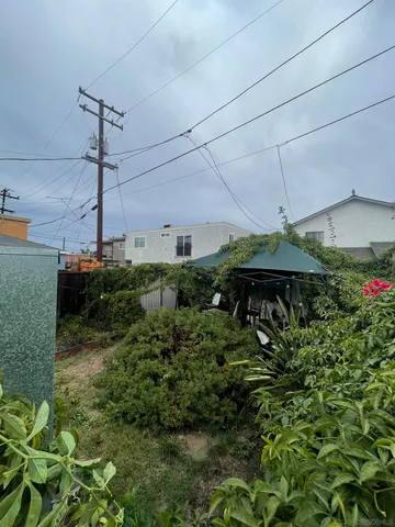 a backyard of a house with lots of green space and fountain