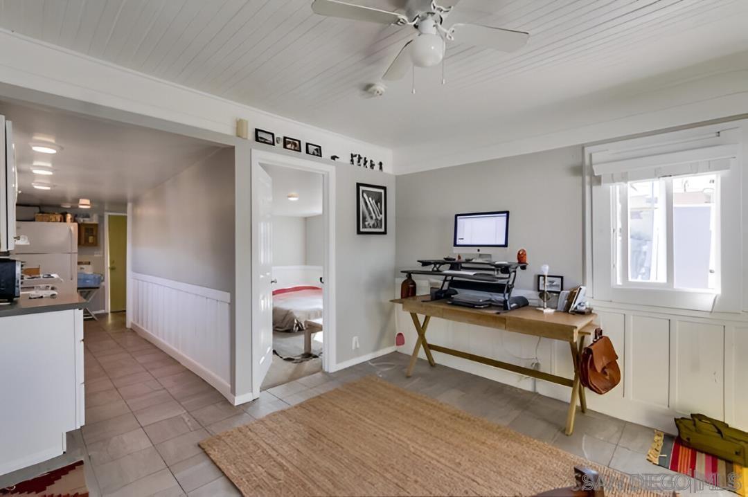 4667 35th Street San Diego, CA 92116 - Photo 22 of 29 a living room with furniture and a flat screen tv
