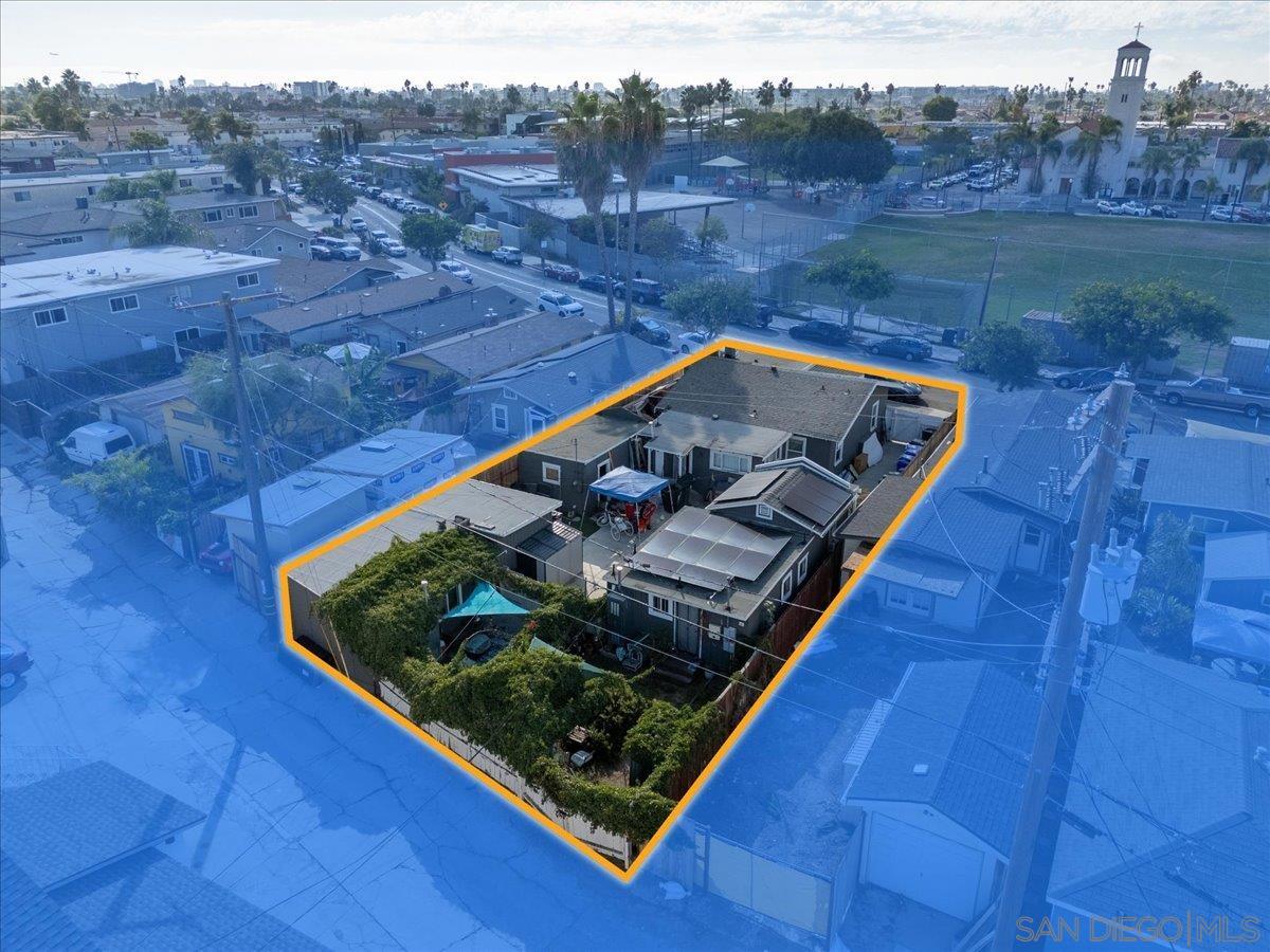 4667 35th Street San Diego, CA 92116 - Photo 28 of 29 a view of a backyard with mountain view and trees in the background