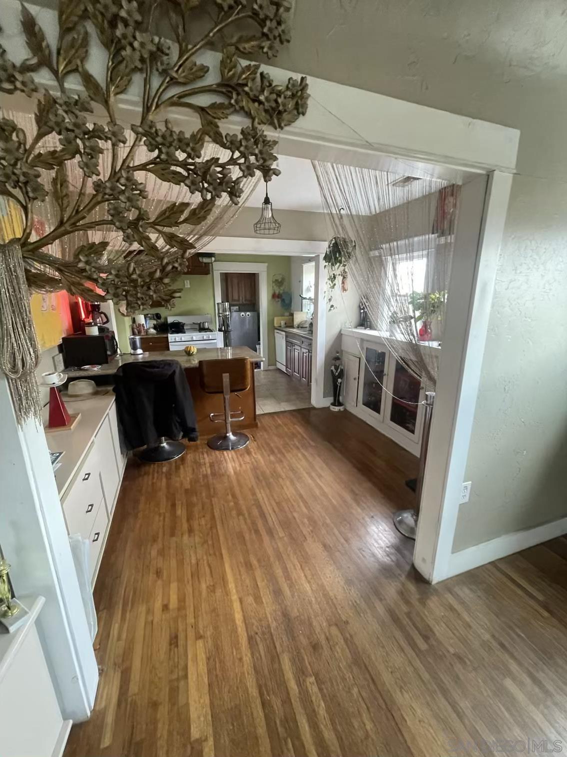 4667 35th Street San Diego, CA 92116 - Photo 5 of 29 a living room with furniture and a fireplace