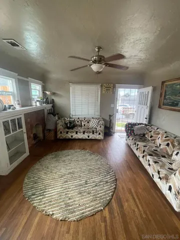 a kitchen with stainless steel appliances granite countertop a stove and a wooden floors