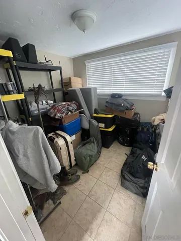 a living room with furniture and a gate