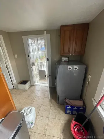 a bed sitting in a room next to a window