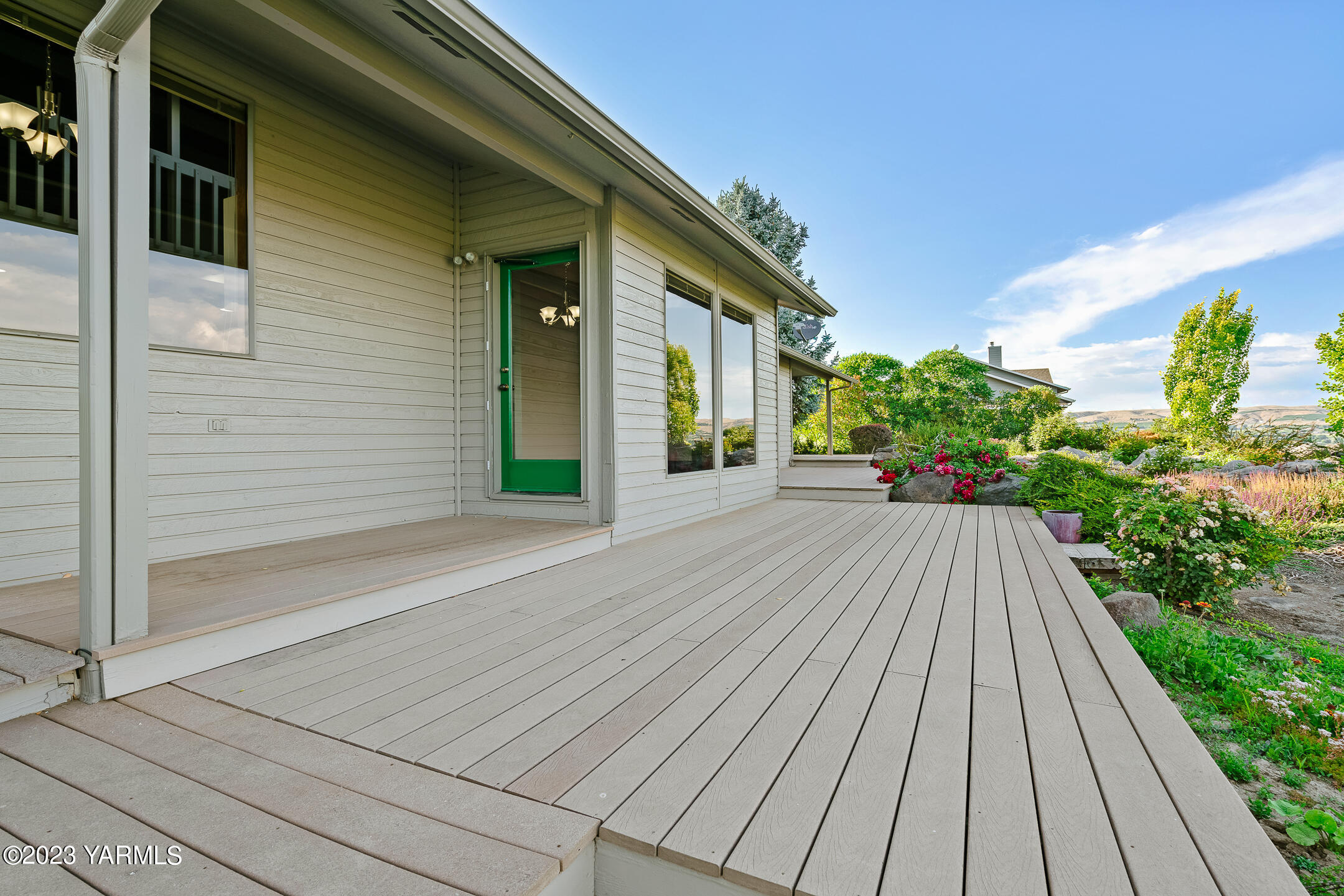 291 Orchard Street Yakima, WA 98908 - Photo 23 of 35 a view of a house with a backyard