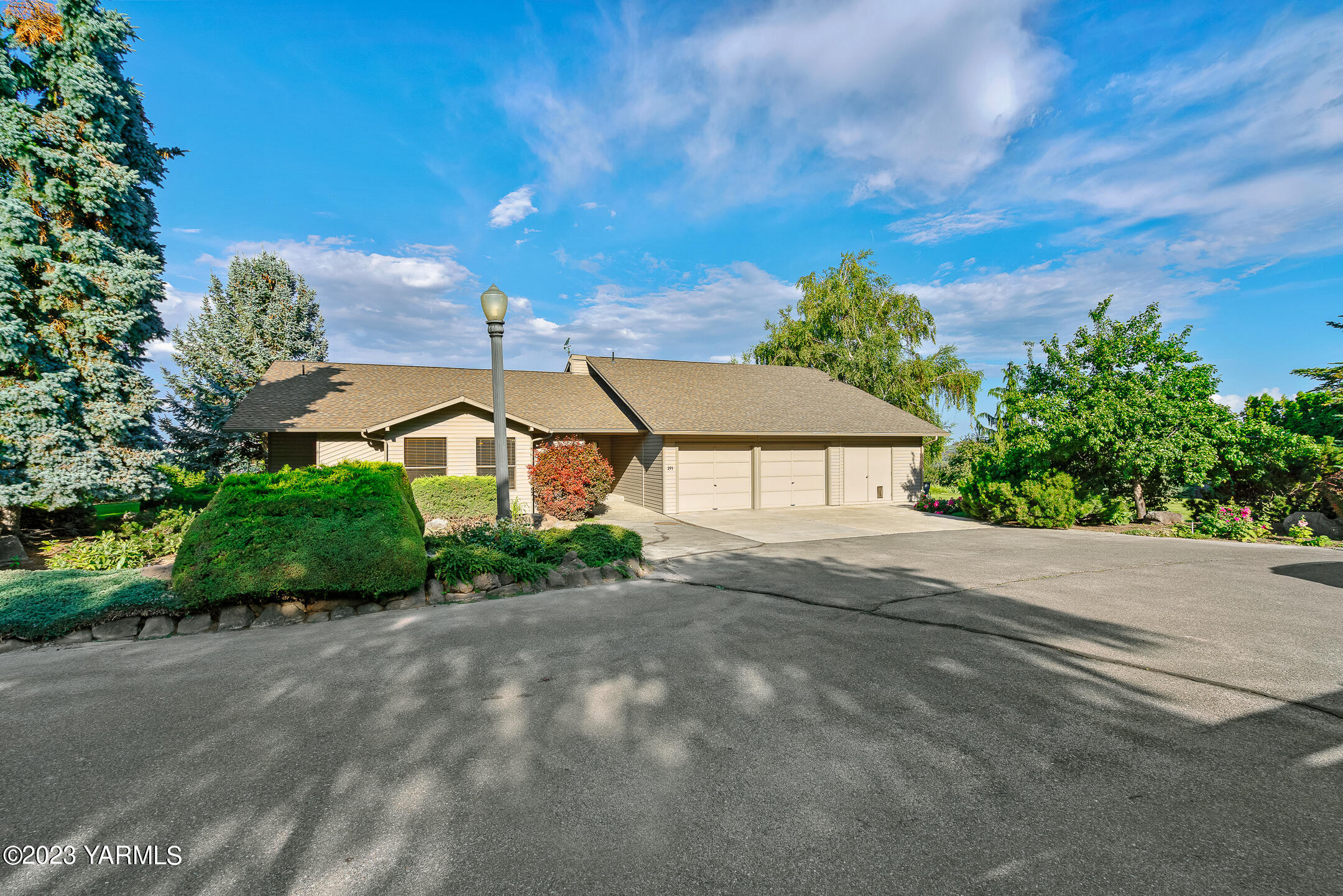 291 Orchard Street Yakima, WA 98908 - Photo 26 of 35 a view of a house with a yard and potted plants