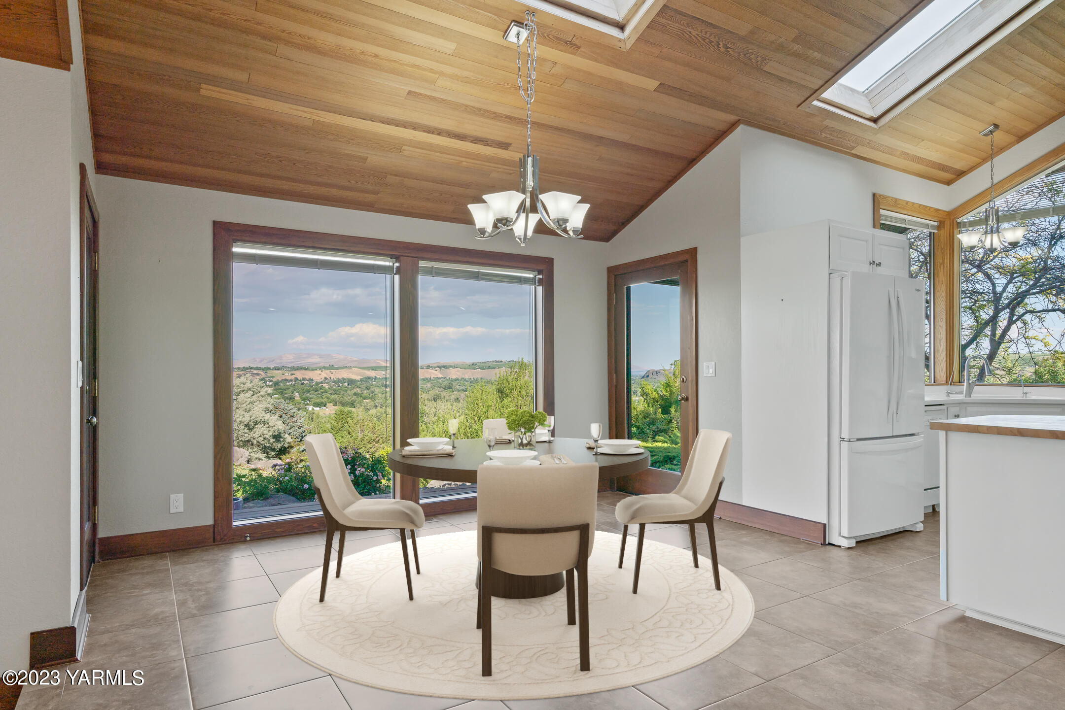 291 Orchard Street Yakima, WA 98908 - Photo 7 of 35 a dining room with furniture a chandelier and outdoor view