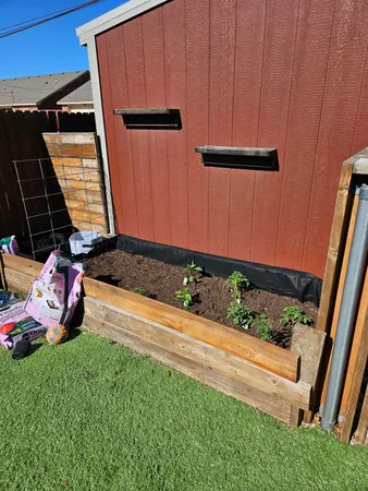 a view of a backyard with sitting area