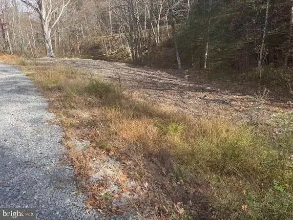 a fire hydrant in the middle of a yard