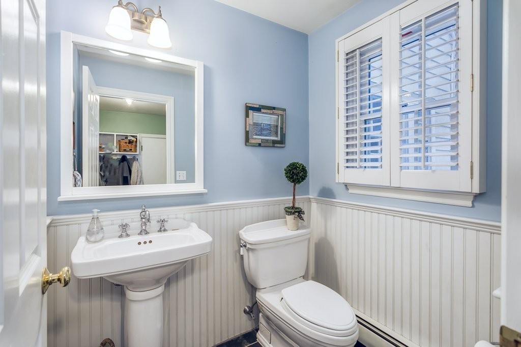 2 Wilson Road Concord, MA 01742 - Photo 13 of 19 a bathroom with a sink a toilet and a mirror