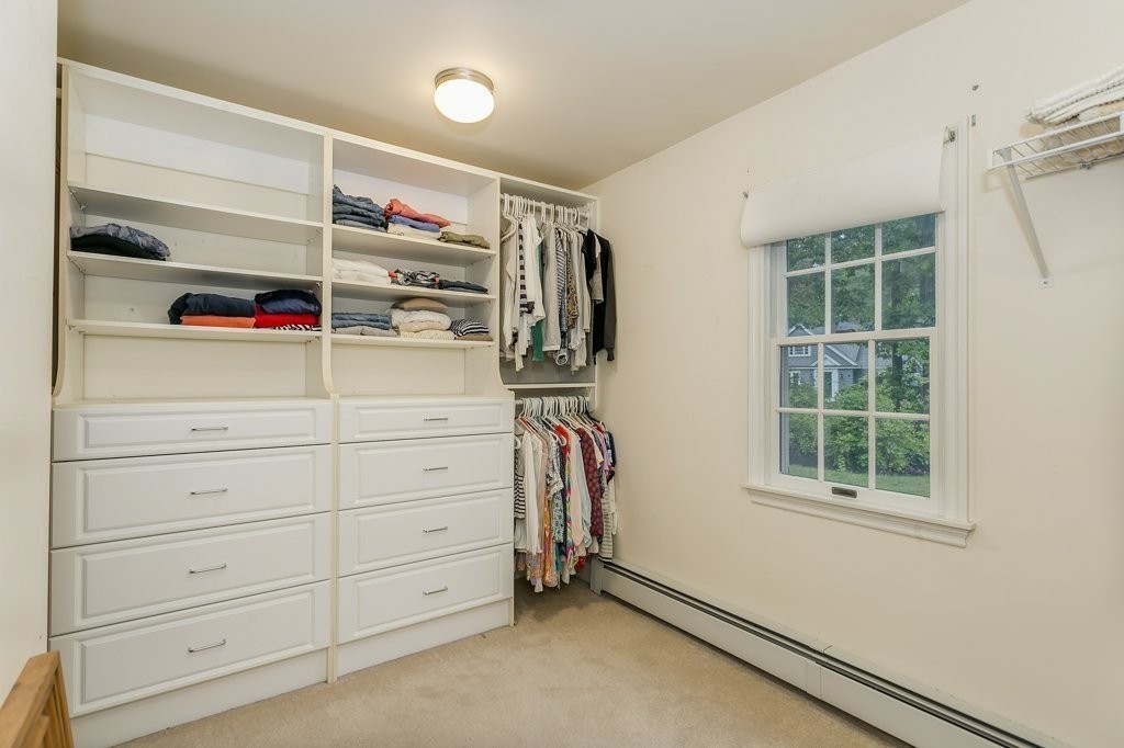 2 Wilson Road Concord, MA 01742 - Photo 15 of 19 a view of walk in closet with clothes and shoes