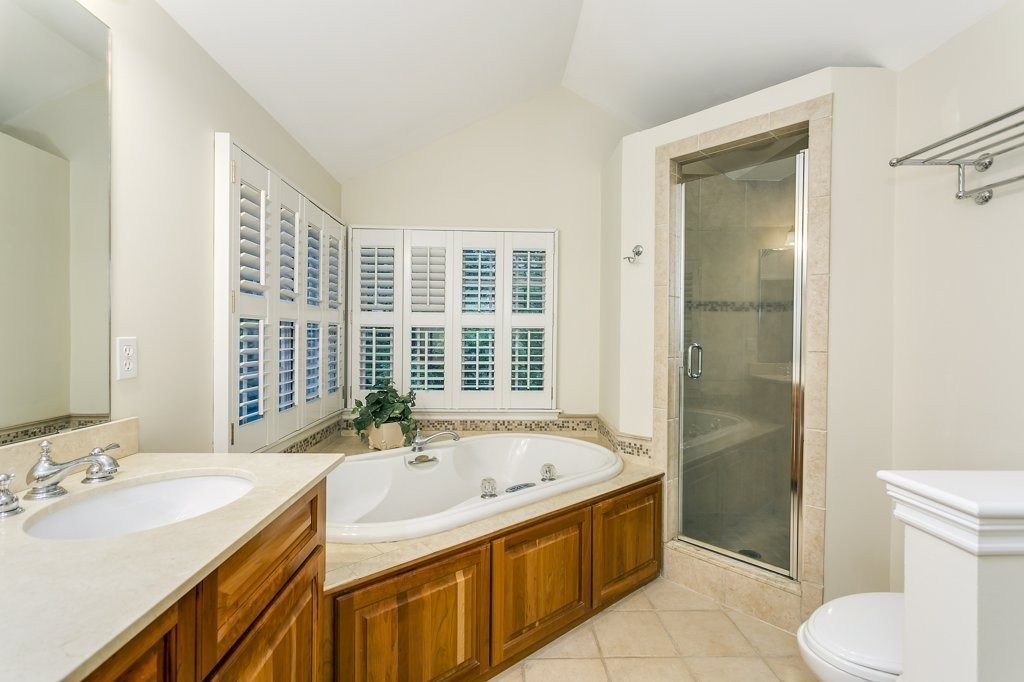 2 Wilson Road Concord, MA 01742 - Photo 16 of 19 a bathroom with a tub sink and mirror