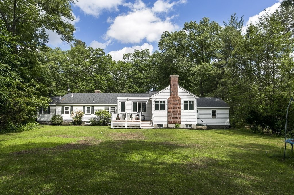 2 Wilson Road Concord, MA 01742 - Photo 3 of 19 a front view of a house with a garden