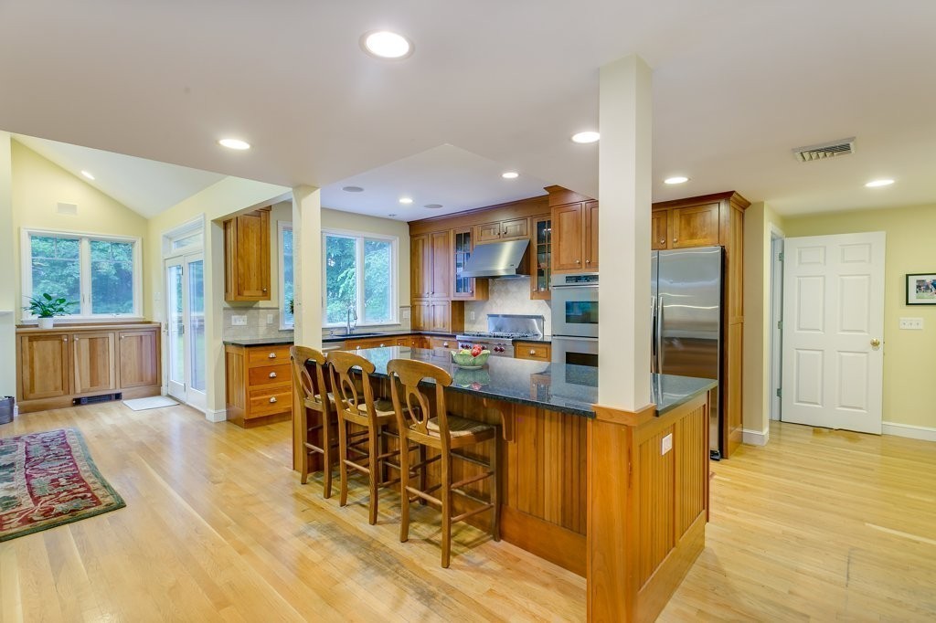 2 Wilson Road Concord, MA 01742 - Photo 5 of 19 a large kitchen with lots of counter space wooden floor and appliances