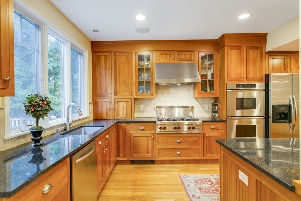 2 Wilson Road Concord, MA 01742 - Photo 8 of 19 a kitchen with stainless steel appliances granite countertop a sink stove and refrigerator