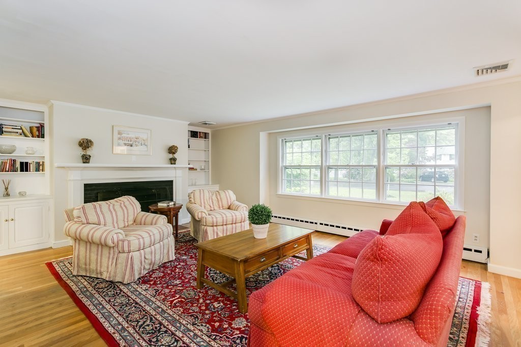 2 Wilson Road Concord, MA 01742 - Photo 10 of 19 a living room with furniture fireplace and a large window