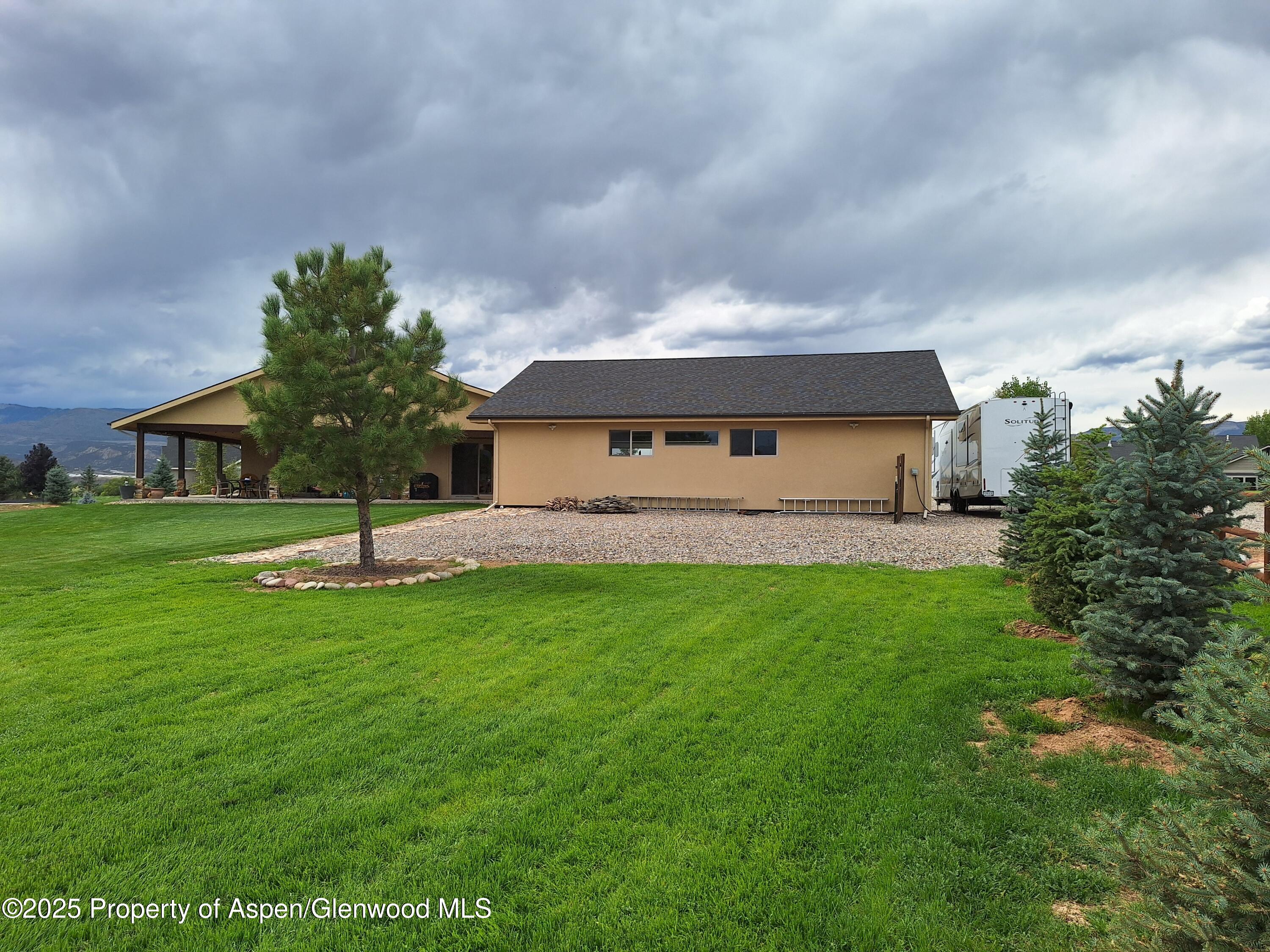 265 South Meadow Drive Rifle, CO 81650 - Photo 19 of 76 a view of front of house with a yard