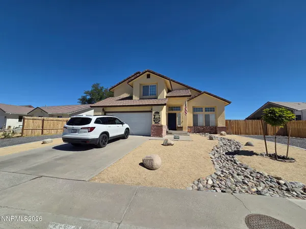 a car parked in front of a house