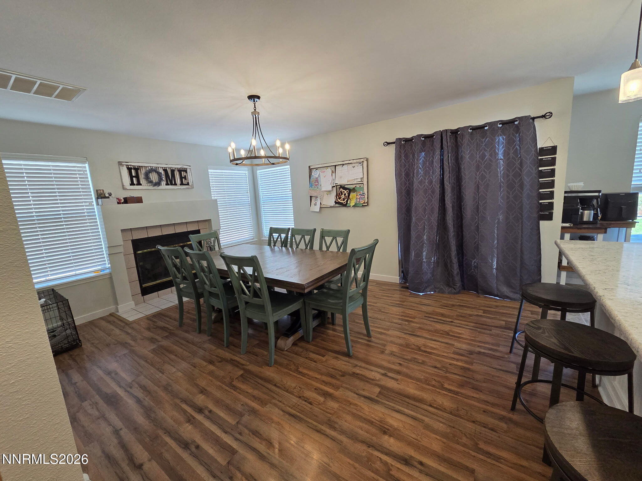 1383 Rambling Wind Drive Fallon, NV 89406 - Photo 12 of 15 a view of a dining room with furniture window and wooden floor