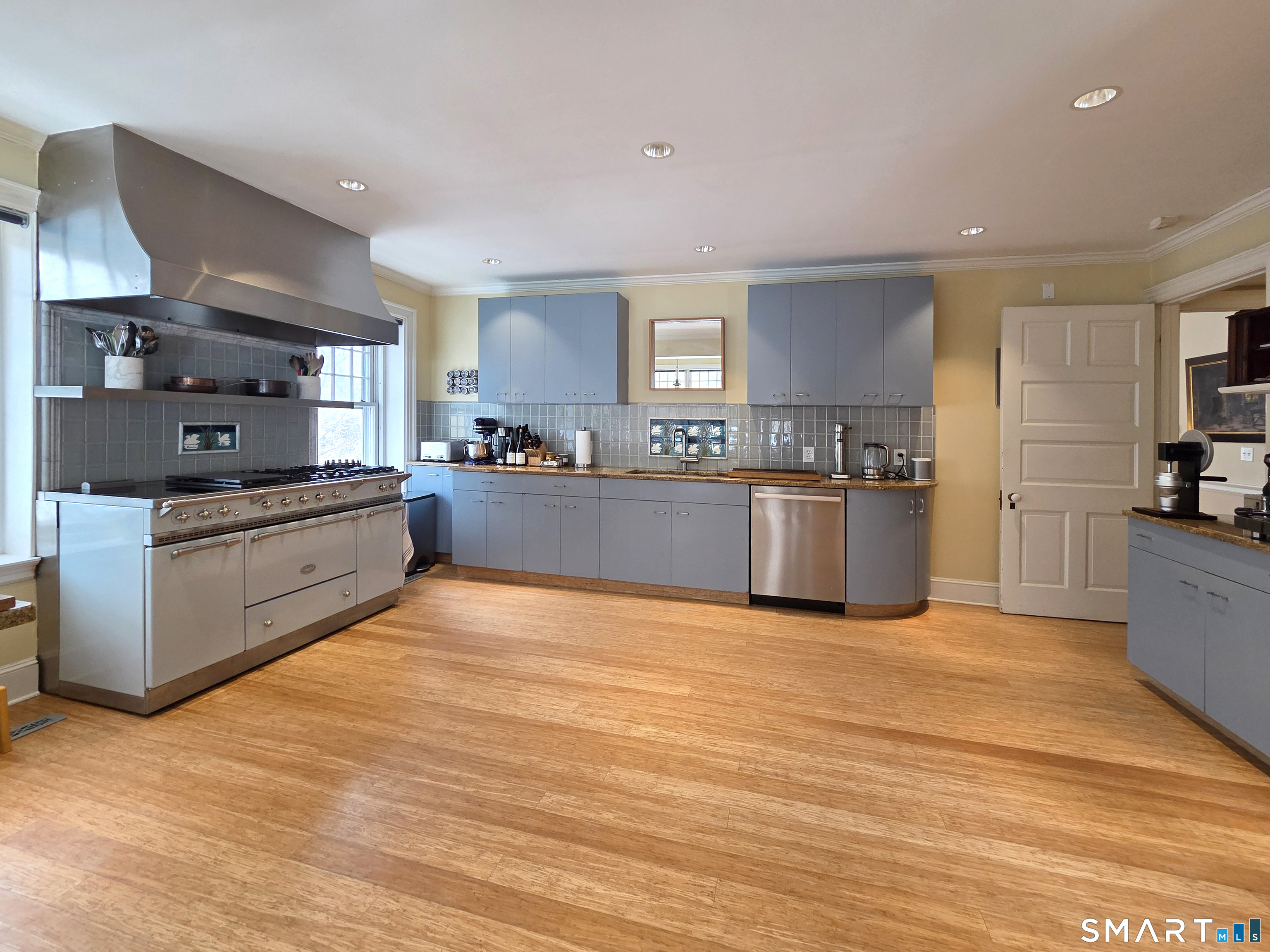 82 Edgehill Road New Haven, CT 06511 - Photo 13 of 29 a large kitchen with stainless steel appliances granite countertop a stove and a sink
