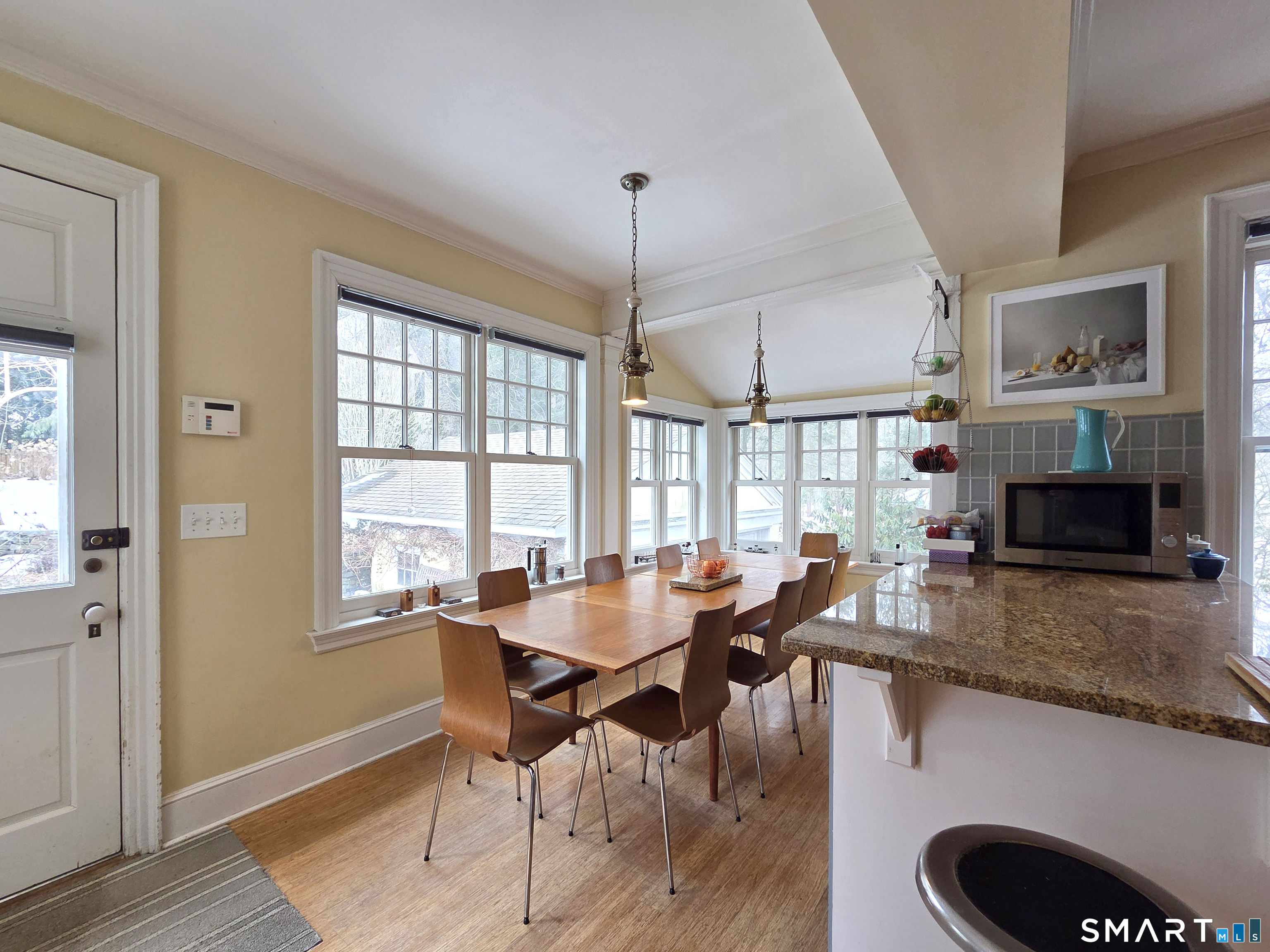 82 Edgehill Road New Haven, CT 06511 - Photo 15 of 29 a dining room with furniture a chandelier and wooden floor