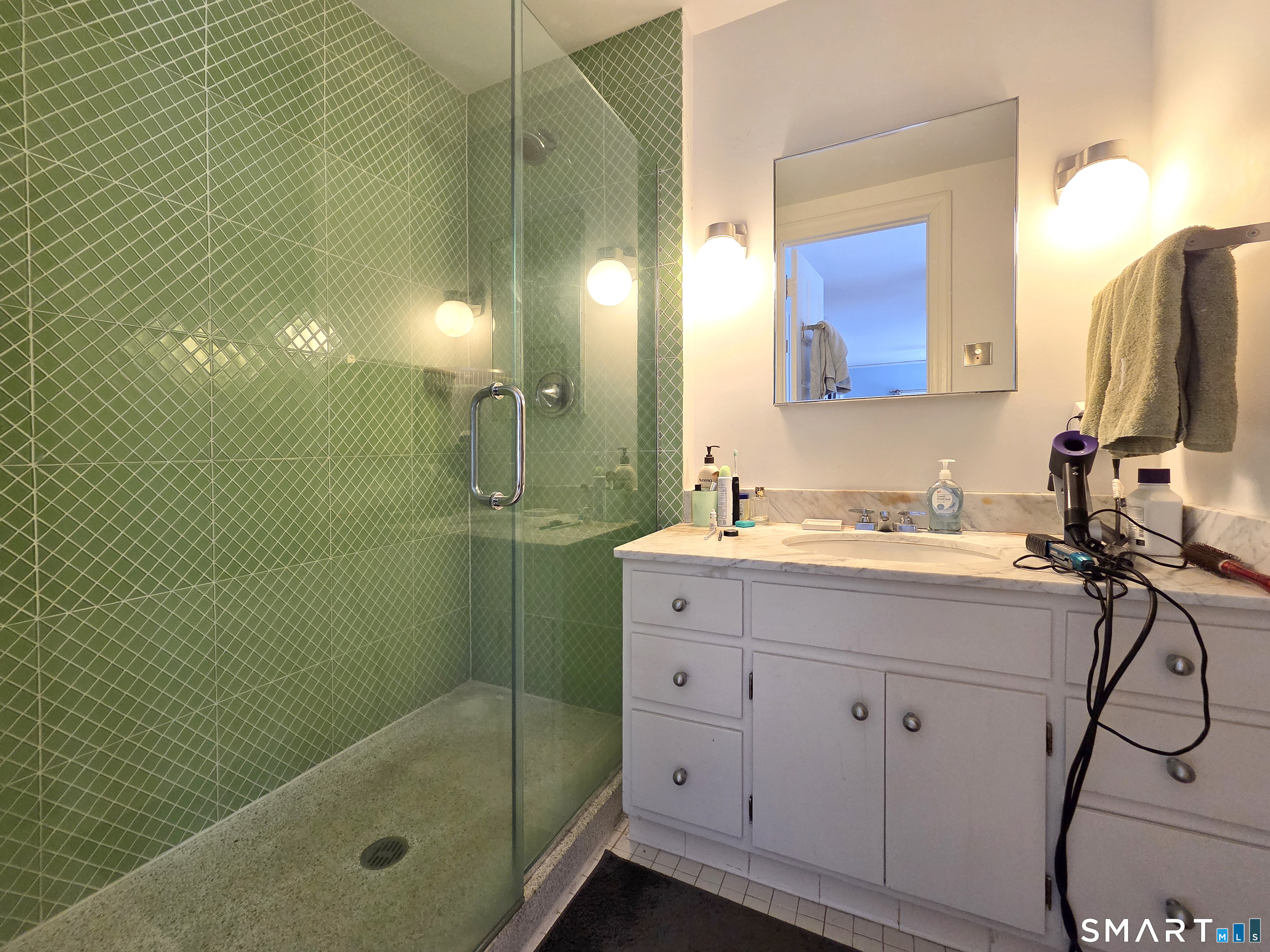 82 Edgehill Road New Haven, CT 06511 - Photo 20 of 29 a bathroom with a shower sink and mirror