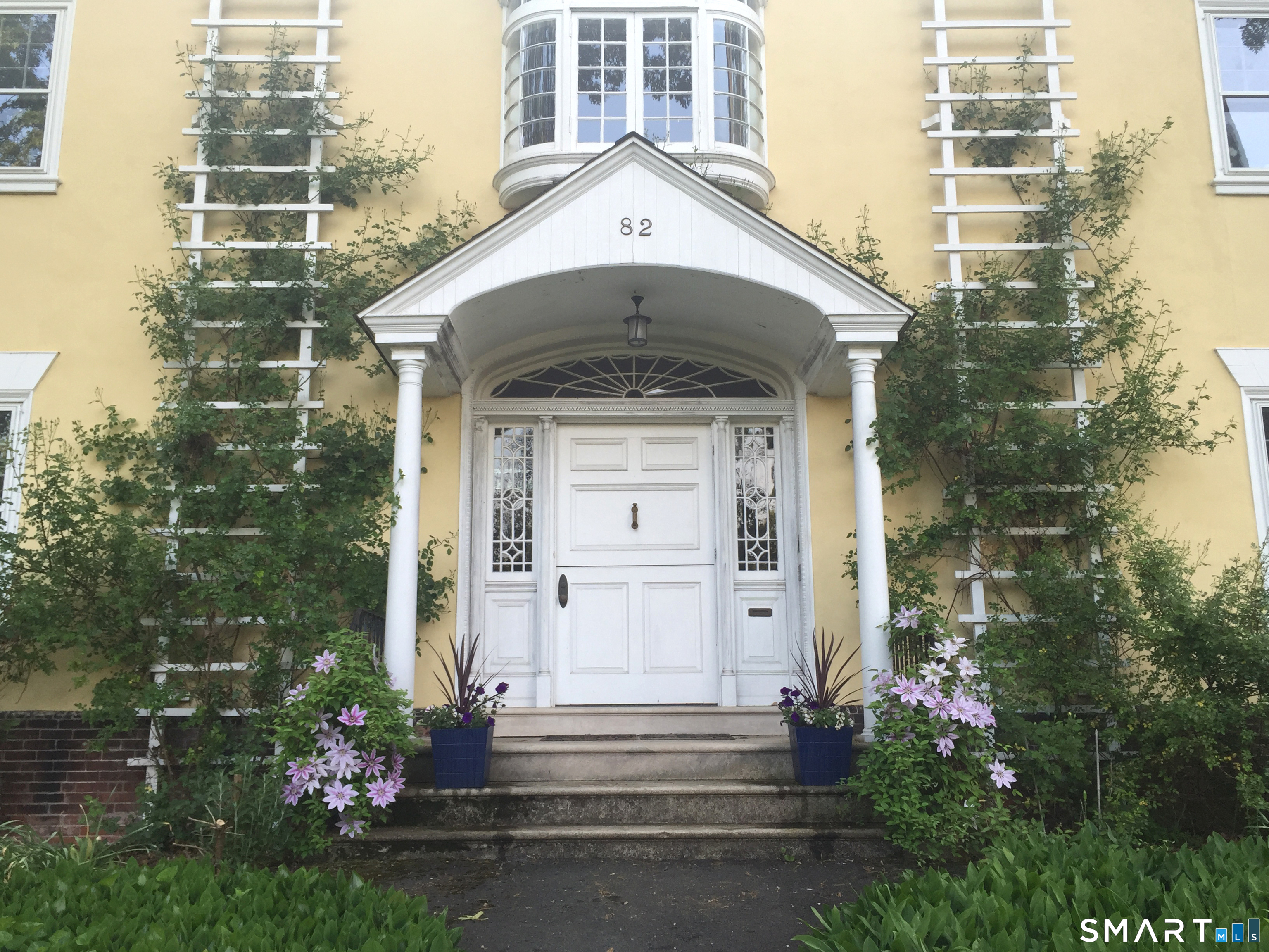 82 Edgehill Road New Haven, CT 06511 - Photo 2 of 29 a front view of a house with plants