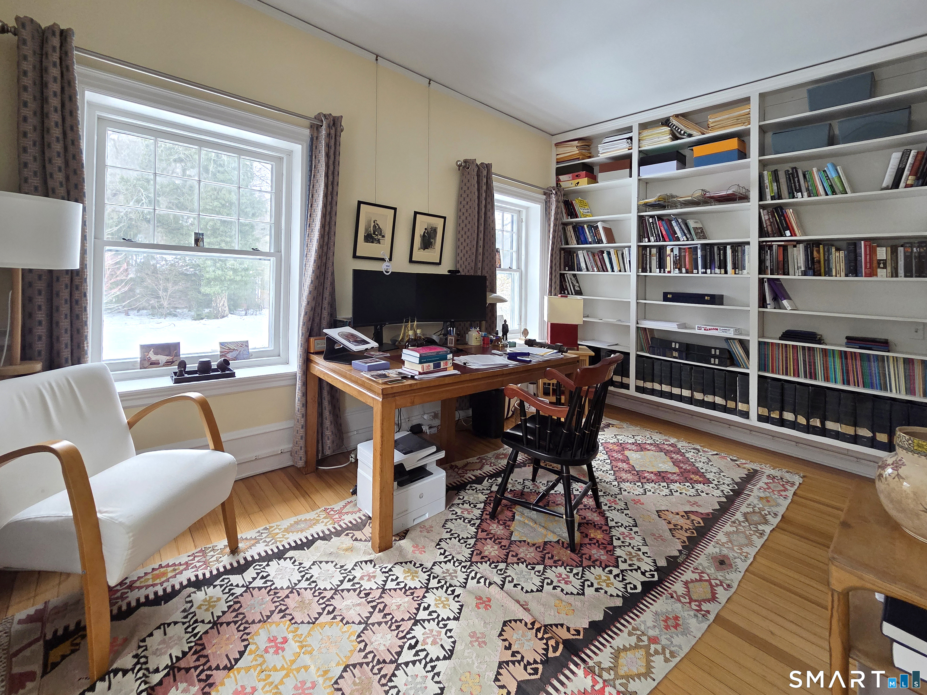 82 Edgehill Road New Haven, CT 06511 - Photo 22 of 29 a living room with furniture a rug and a bookshelf