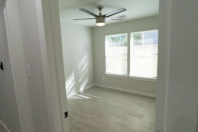 a view of a hallway with washer and dryer