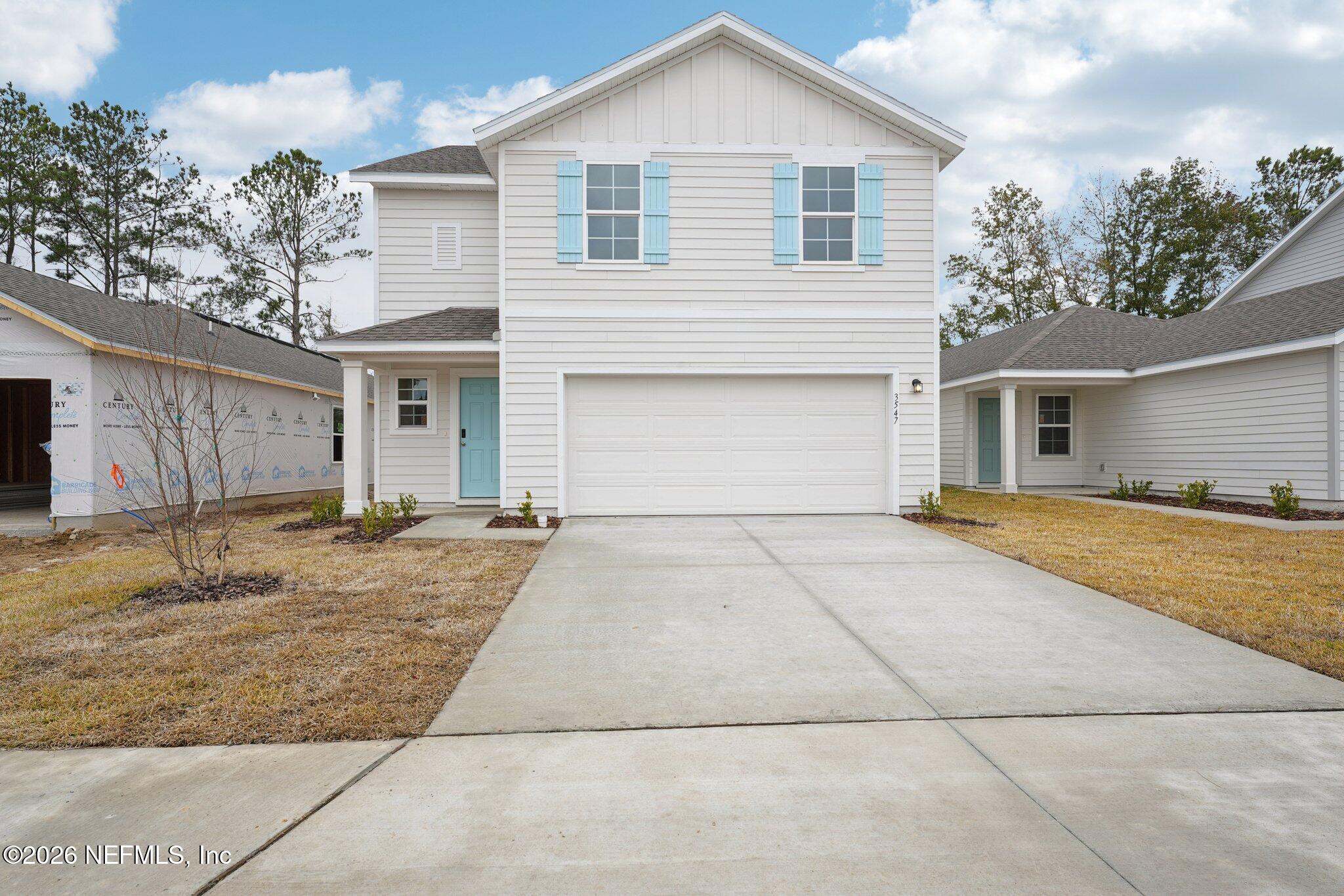 3547 Mildred Way Jacksonville, FL 32254 - Photo 2 of 13 a view of garage yard and front view of a house