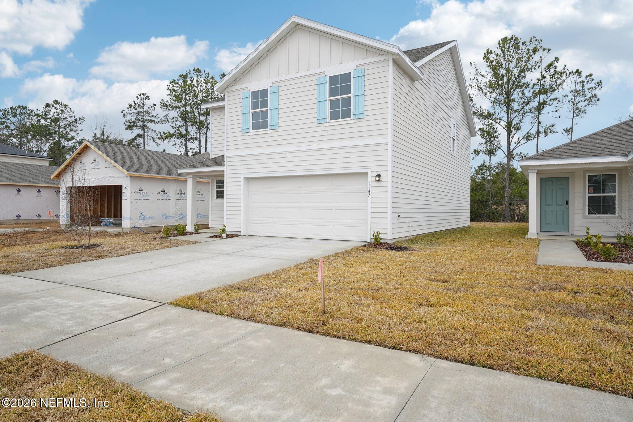 3547 Mildred Way Jacksonville, FL 32254 - Photo 3 of 13 a view of garage yard and front view of a house