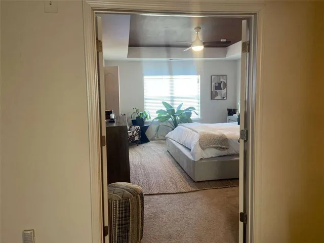 a bed room with a bed and a window