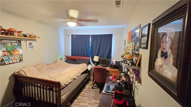 a bed room with a bed and a window