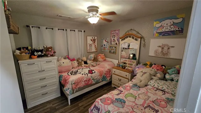 a bedroom with furniture and a chandelier
