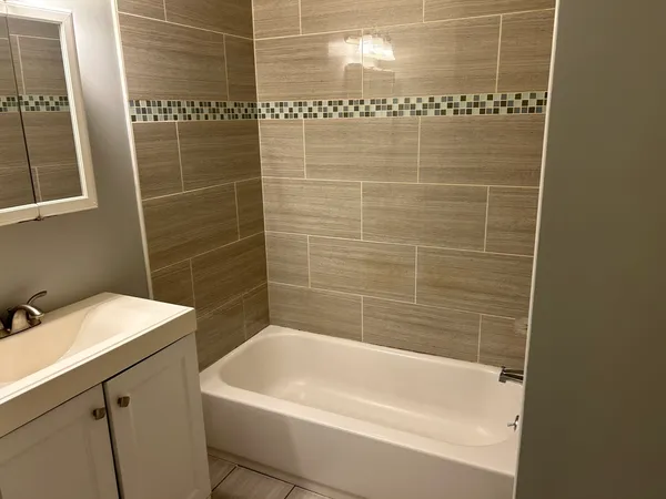 a kitchen with stainless steel appliances a refrigerator and a stove top oven