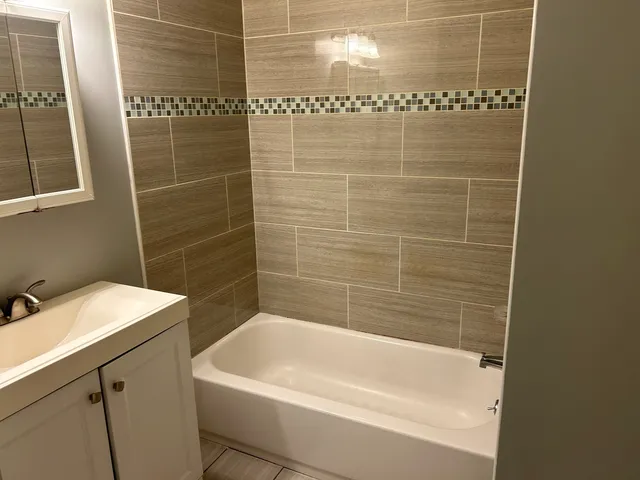 a kitchen with stainless steel appliances a refrigerator and a stove top oven