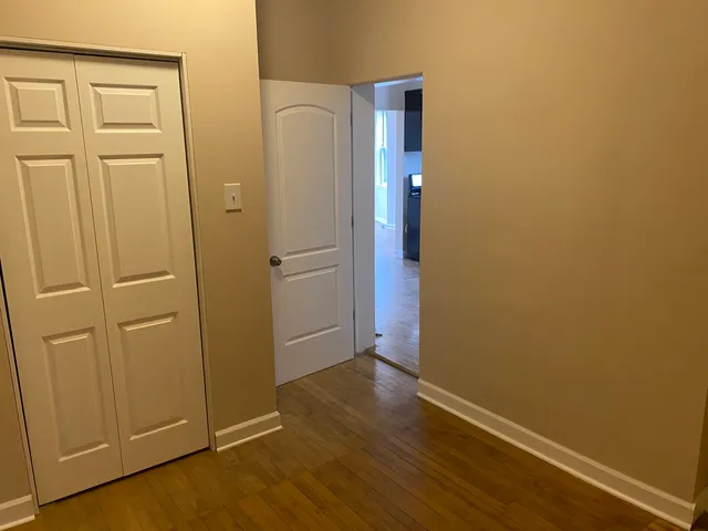 a bathroom with a toilet and a bathtub