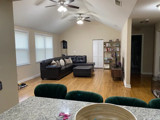 a bathroom with a toilet and a shower curtain