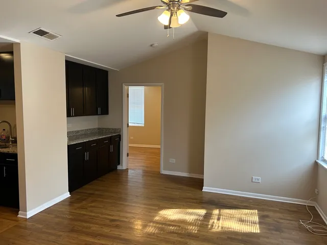 a view of a kitchen from the hallway