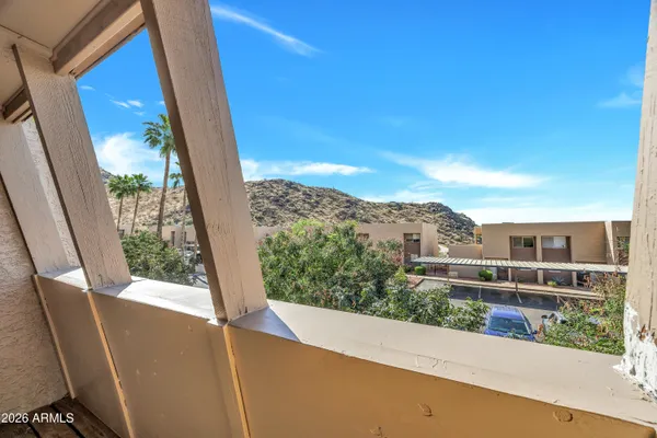 a view of a balcony with an outdoor space