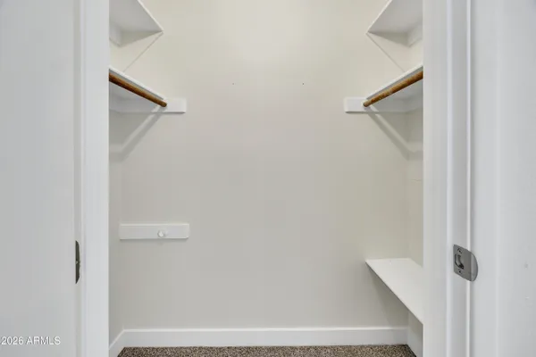 a view of staircase with white walls