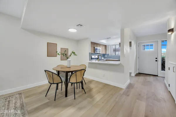 a dining room with furniture and window