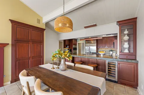 a kitchen with granite countertop breakfast area